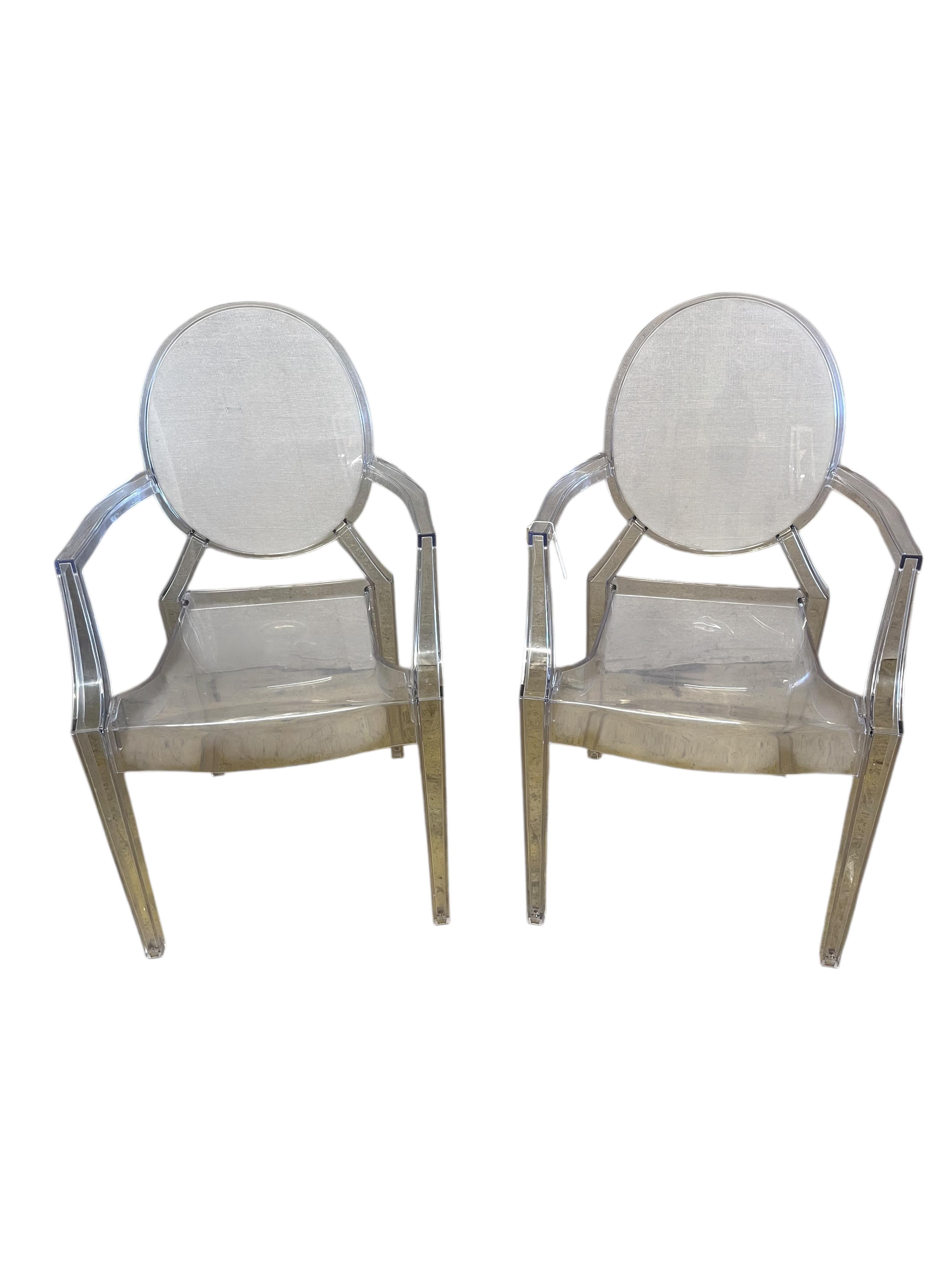 A pair of Philip Starck ghost chairs, width 54cm, depth 42cm, height 90cm